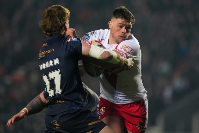 Picture by Olly Hassell/SWpix.com - 15/02/2025 - Rugby League - Betfred Super League Round 1 - St Helens v Salford Red Devils - The Totally Wicked Stadium, St Helens, England - Morgan Knowles of St Helens is tackled by Kai Morgan of Salford