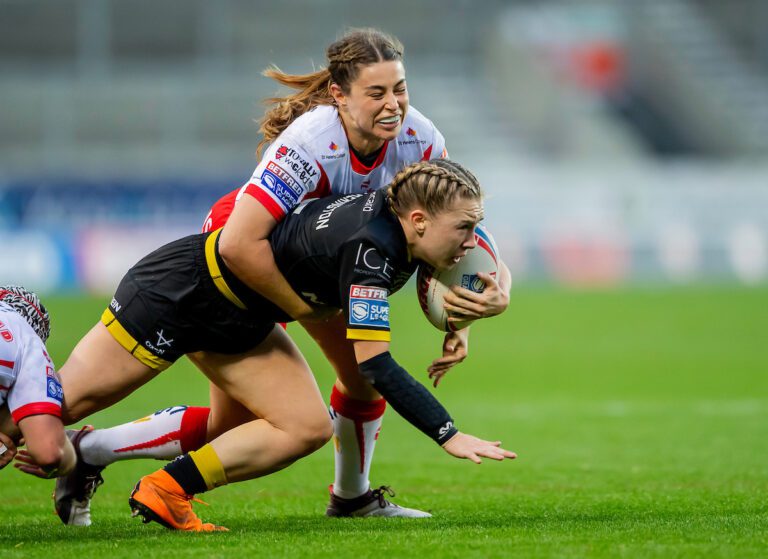 Picture by Allan McKenzie/SWpix.com - 06/10/2024 - Rugby League - Betfred Women's Super League Grand Final - St Helens v York Valkyrie - The Totally Wicked Stadium, St Helens, England - York's Georgina Hetherington is tackled by St Helens' Emily Rudge.