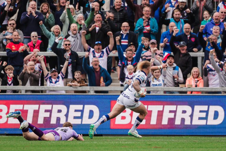 Picture by Alex Whitehead/SWpix.com - 18/05/2025 - Rugby League - Betfred Super League: Round 11 - Wakefield Trinity vs Warrington Wolves - The DIY Kitchens Stadium, Wakefield, England - Caius Faatili of Wakefield runs in to score a try.