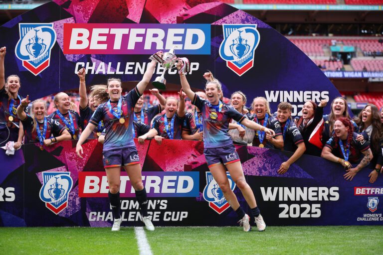 Picture by Ed Sykes/SWpix.com - 07/06/2025 - Rugby League - Betfred Women's Challenge Cup Final - St Helens v Wigan Warriors - Wembley Stadium, London, England - Wigan Warriors' Victoria Molyneux and Georgia Wilson lift the trophy