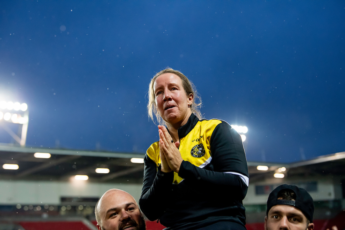 Picture by Allan McKenzie/SWpix.com - 06/10/2024 - Rugby League - Betfred Women's Super League Grand Final - St Helens v York Valkyrie - The Totally Wicked Stadium, St Helens, England - York coach Lindsay Anfield emotional as she's held aloft in front of her fans after her side's victory over St Helens in the Betfred Women's Super League Grand Final.