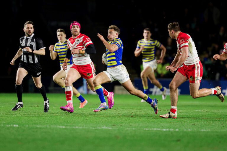 Picture by Alex Whitehead/SWpix.com - 13/02/2026 - Rugby League - Betfred Super League: Round 1 - Warrington Wolves vs St Helens - Halliwell Jones Stadium, Warrington, England - Cai Taylor-Wray of Warrington runs in to score a try.