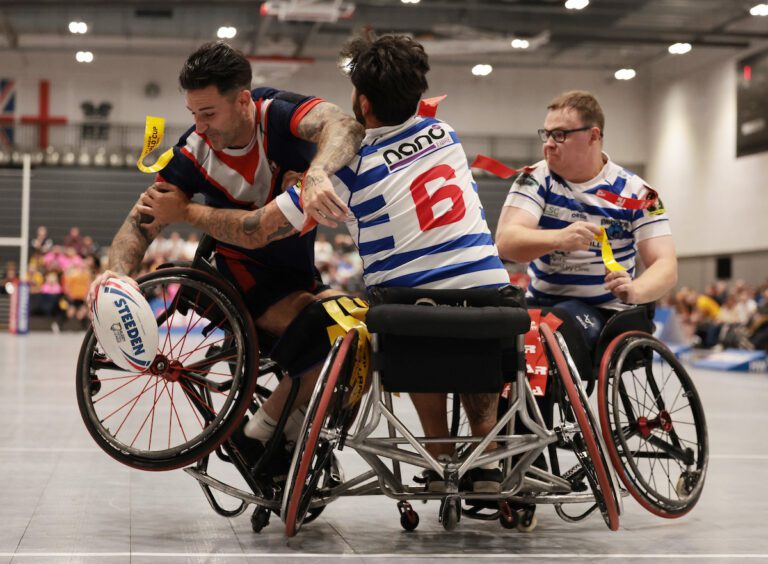 Picture by John Clifton/SWpix.com - 28/09/2025 - Rugby League - Betfred Wheelchair Super League Grand Final - Halifax Panthers v London Roosters - National Basketball Performance Centre, Manchester, England - London Rooster' Lewis King in action with Halifax Panthers' Nathan Holmes