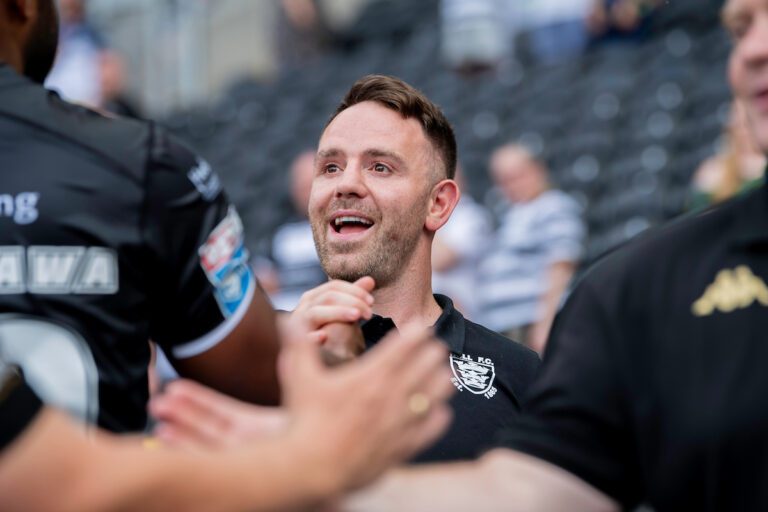 Picture by Allan McKenzie/SWpix.com - 20/07/2024 - Rugby League - Betfred Super League Round 18 - Hull FC v Wigan Warriors - MKM Stadium, Kingston upon Hull, England - Hull FC director of rugby Richie Myler congratulates players after their side's victory over Wigan.