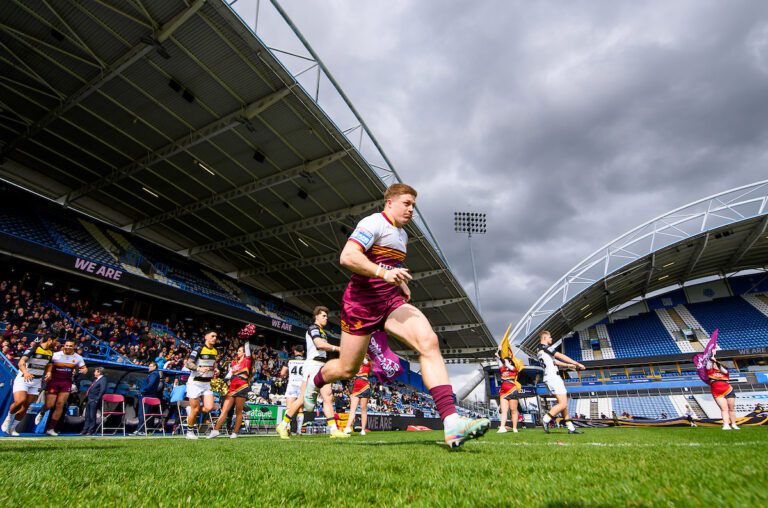 Picture by Allan McKenzie/SWpix.com - 04/04/2026 - Rugby League - Betfred Super League Round 7 - Huddersfield Giants v York Knights - Accu Stadium, Huddersfield, England - Huddersfield's Zac Woolford and his side come out the tunnel onto the field of play.